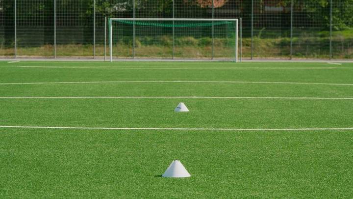 Cones on a training pitch in front of a goal